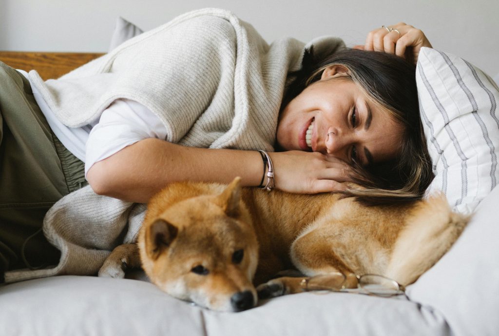 laying with dog